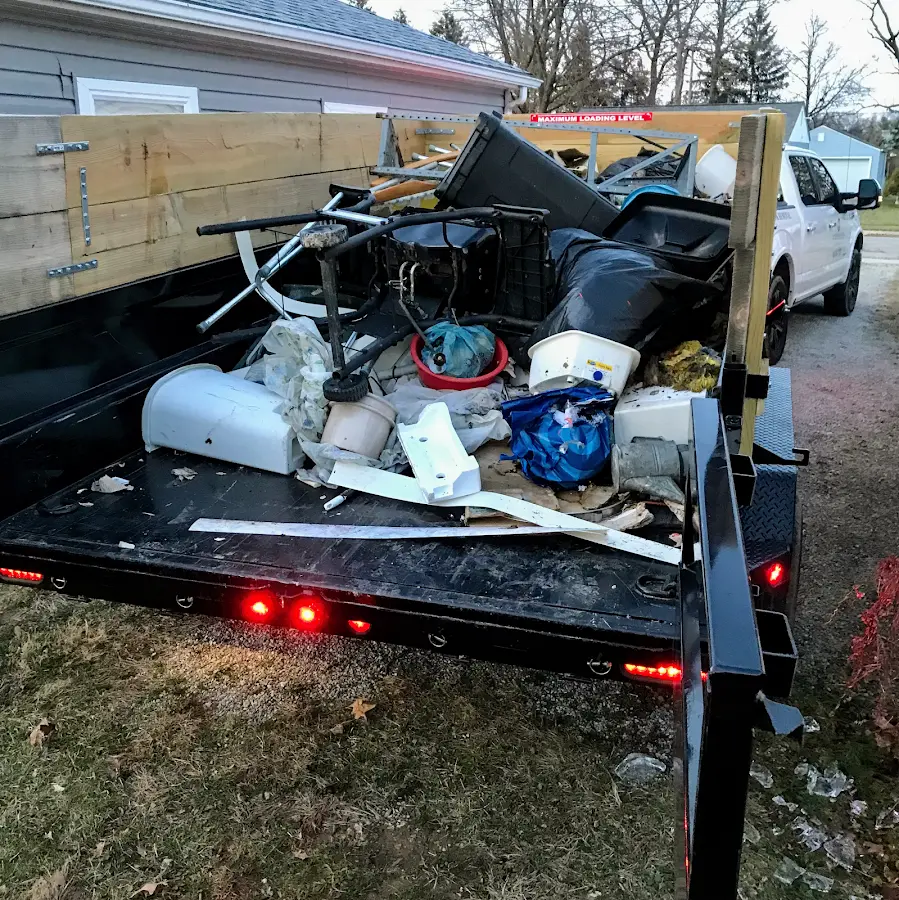 Roll-off dumpster delivered to a residential driveway in Highland